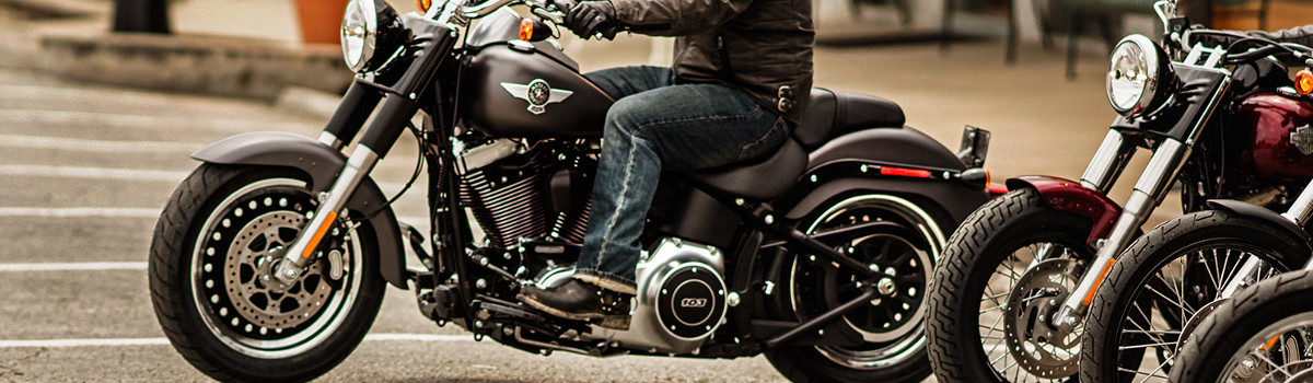 Man riding a black Harley-Davidson® touring motorcycle 